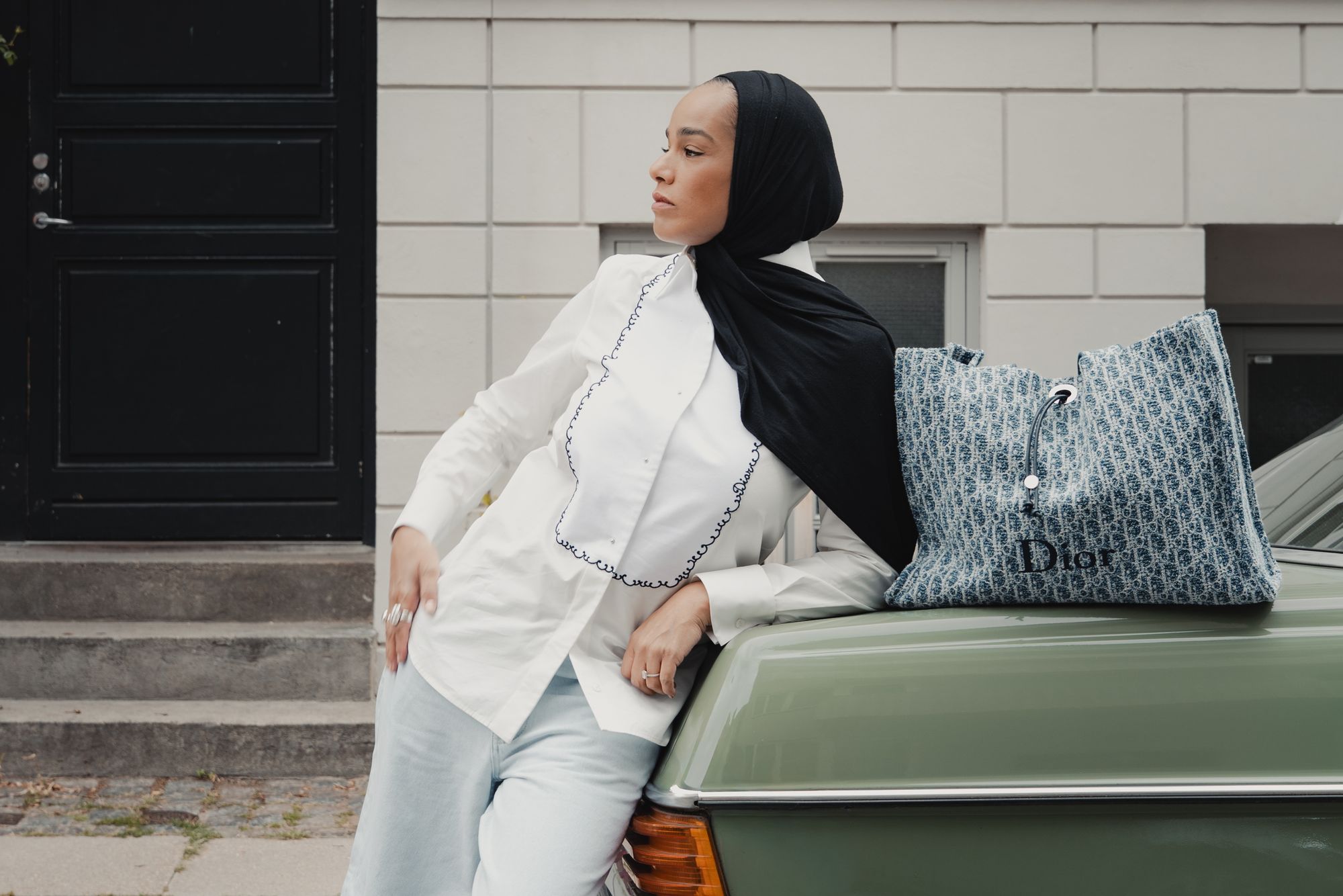 Christian Dior fashion editorial photographed in Copenhagen beside a vintage green Mercedes